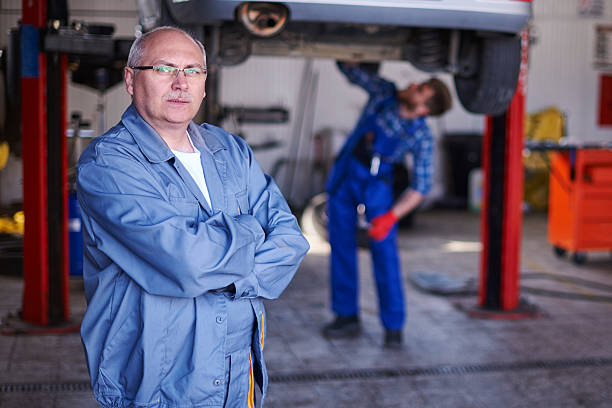 Portrait of owner the best workshop Portrait of owner the best workshop car portrait men expertise stock pictures, royalty-free photos & images