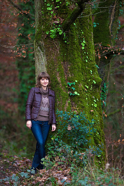 Girl in autumn forest stock photo
