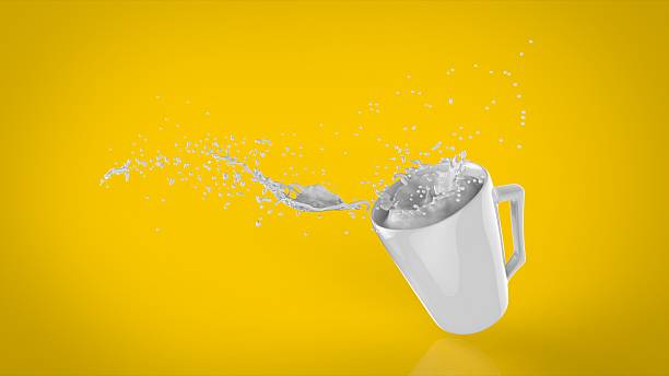 falling cup of milk stock photo