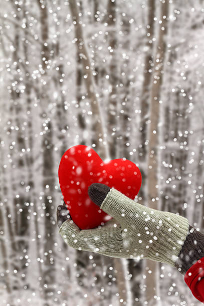 istock Woman hand holding a red heart 474578545