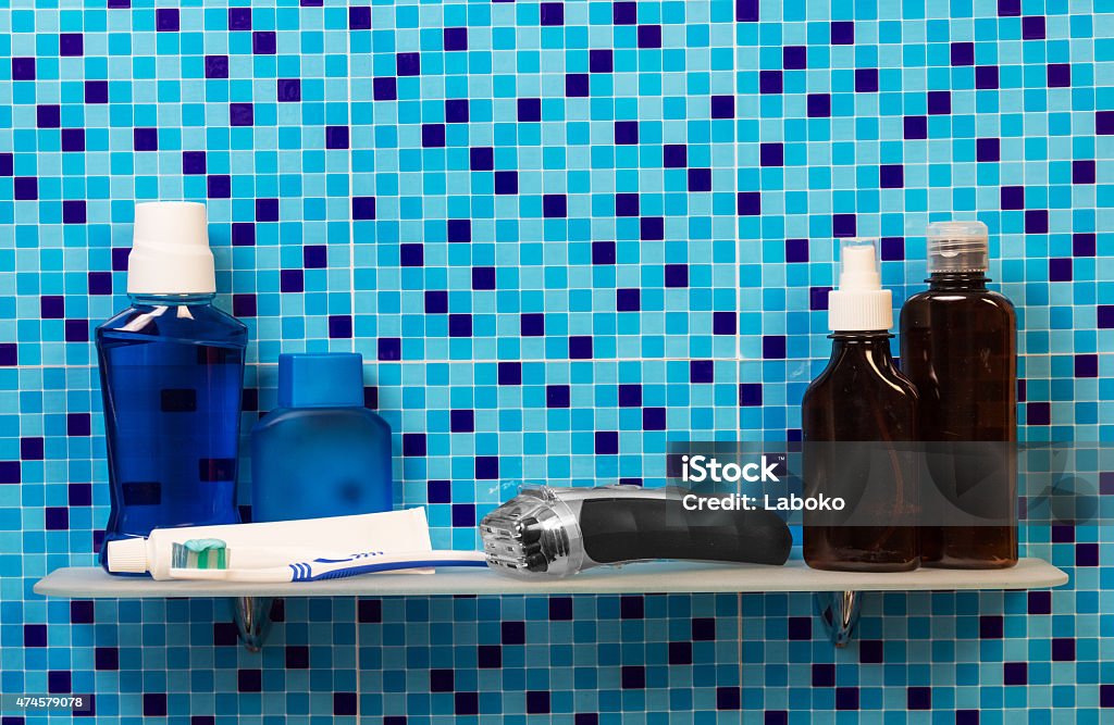 Electric shaver and lotion with deodorant Electric shaver and lotion with deodorant in bathroom 2015 Stock Photo