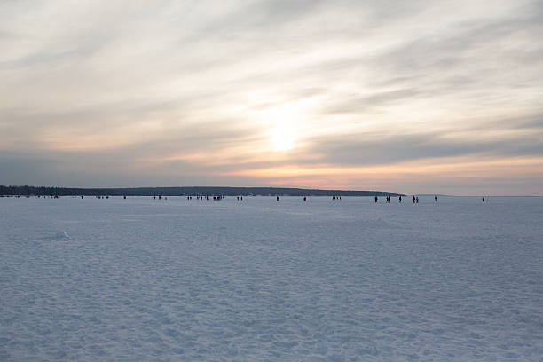 A shot of people walking across Lake Superior at the Bayfield Ice Caves