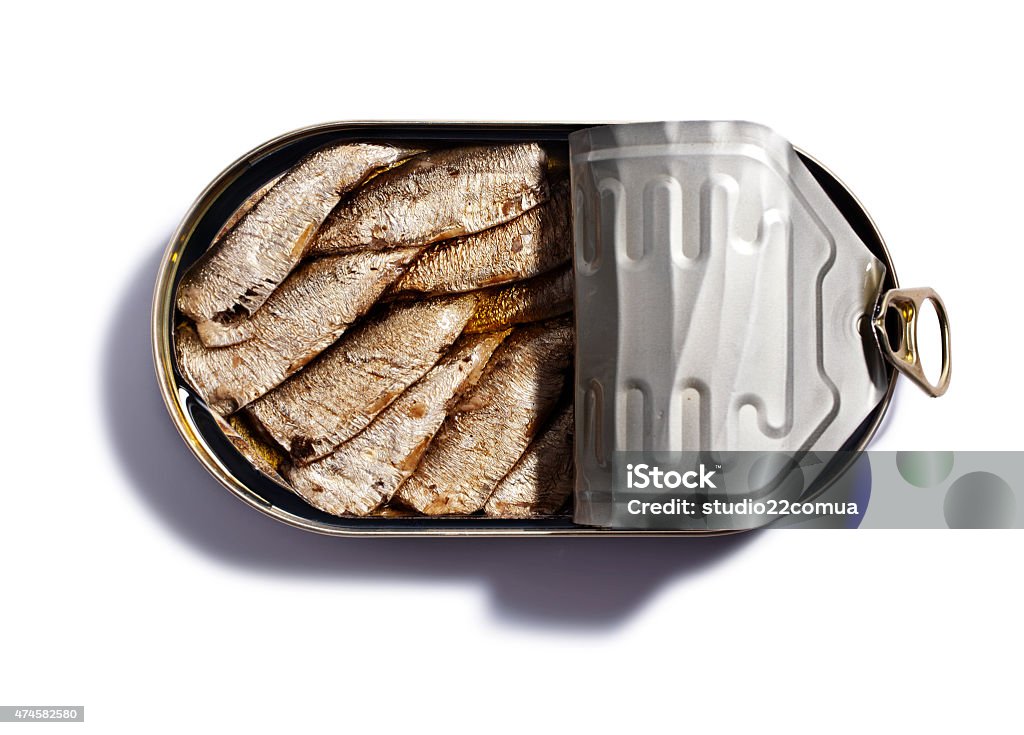Sprats Smoked sprats in oval pot on a white background 2015 Stock Photo