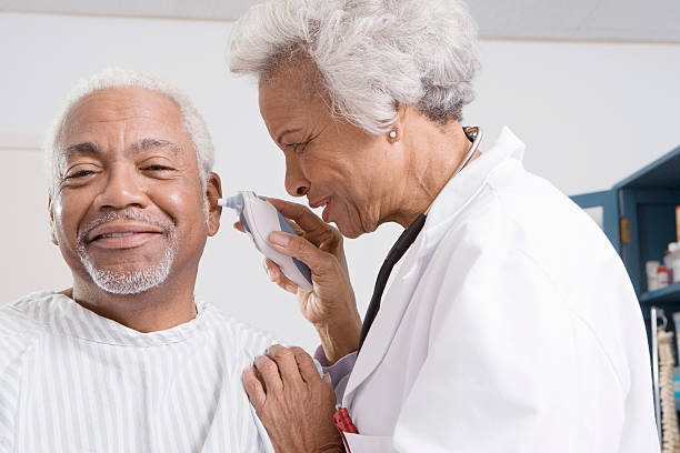 istock Doctor Checking Patient's Ear Using Electronic Otoscope 474585087