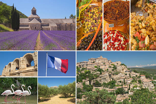 Tourists taking pictures in Lavender fields with blossoming flowers in front of the Abbaye Notre-Dame de Sénanque (Sénanque Abbey) near the village of Gordes in the département of the Vaucluse in Provence, France. during summer.