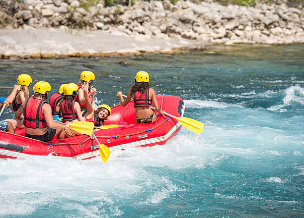 istock Group of people rafting moving into the water 474593480