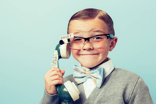 young boy inteligente nerd con tecnología - bizarre nerd humor telephone fotografías e imágenes de stock