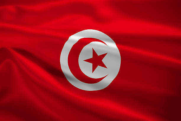 Tunisia flag blowing in the wind stock photo