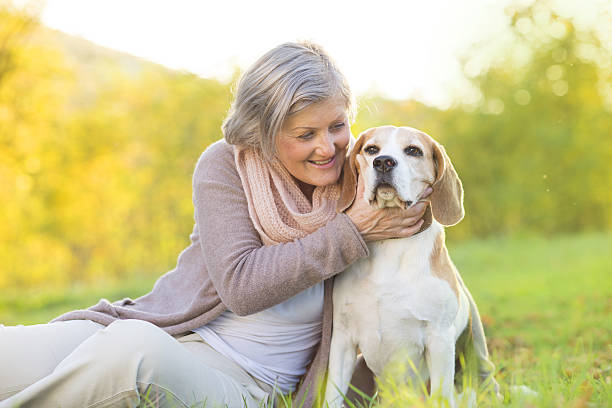 istock Active senior woman hugs dog 474602833