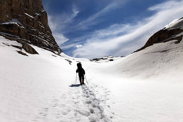 istock Silhouette of hiker on snow plateau 474603094