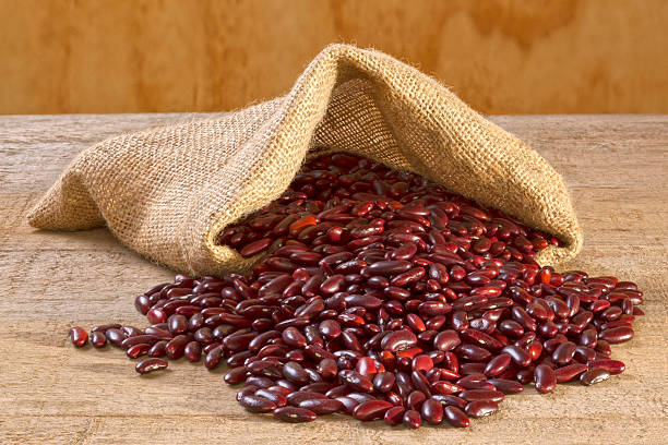 istock Red Kidney Beans Spilling from Sack 474604853