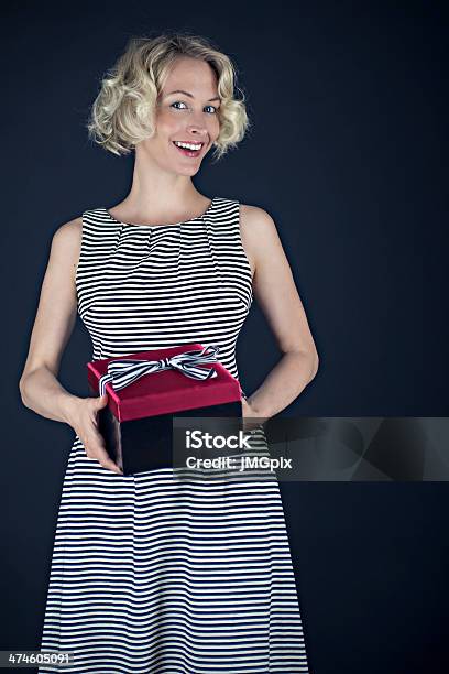 Woman Holding A Gift Stock Photo - Download Image Now - 2000-2009, 30-34 Years, 30-39 Years