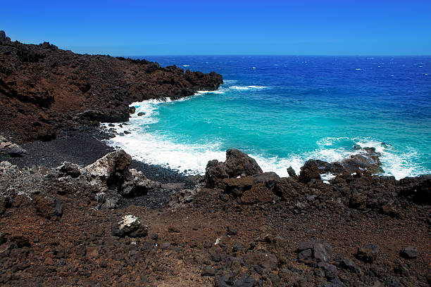 Atlantic volcanic black coast in la Palma with foam in funecaliente Canary Islands