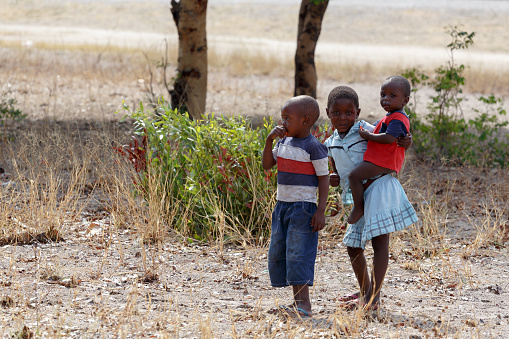 Kavango, Namibia - October 15, 2014:  An unidentified dirty and poor Namibiann childrens near town Rundu in Kavango region, with the highest poverty level in Namibia. October 15, 2014, Namibia