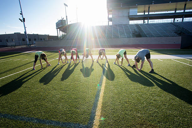 istock Large Group of People Doing a gym Stretch 474606654