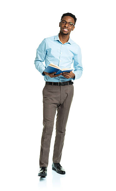 istock Happy african american college student standing with book on white 474607890