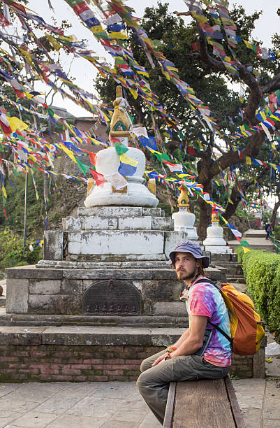 istock man near the Buddhist stupa - Tourist 474607896