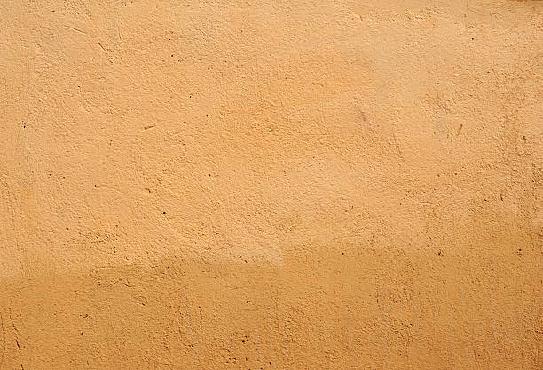 istock Texture of old wall covered with brown stucco 474608186