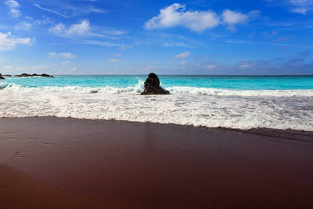 Beach el Bollullo black brown sand and aqua water