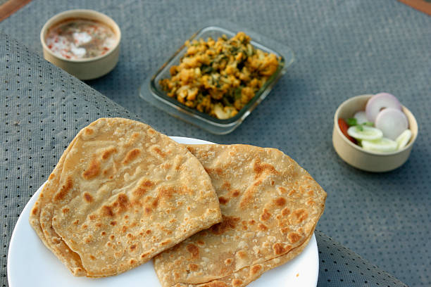 istock Paratha (or parantha) is a flatbread that originated in India 474609939