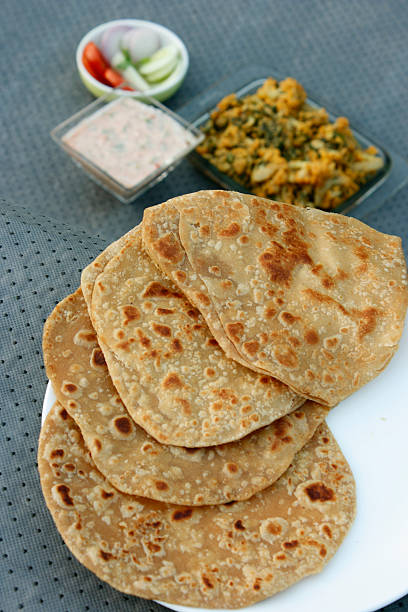 istock Paratha (or parantha) is a flatbread that originated in India 474610743