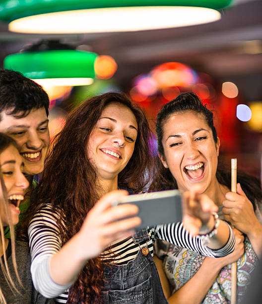 istock Happiness friends in a pub take a selfie 474611364