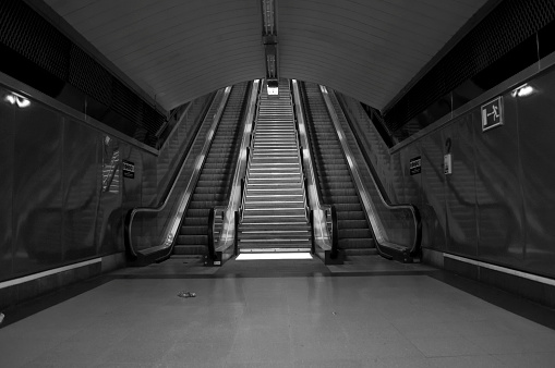 Deserted Las Filipinas district Metro Station in Madrid with litter on floor
