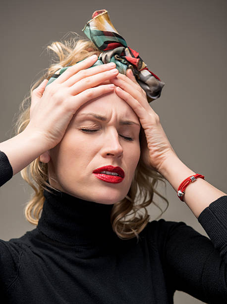 istock Woman suffering from headache 474611843