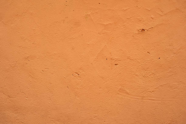istock Texture of old wall covered with brown stucco 474612540