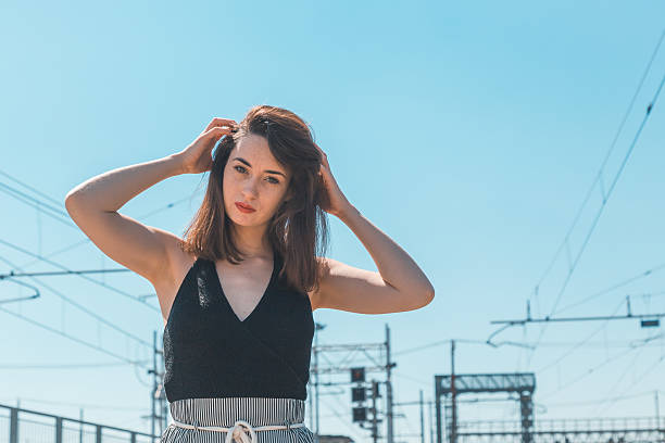 istock Beautiful brunette posing in an industrial context 474612606