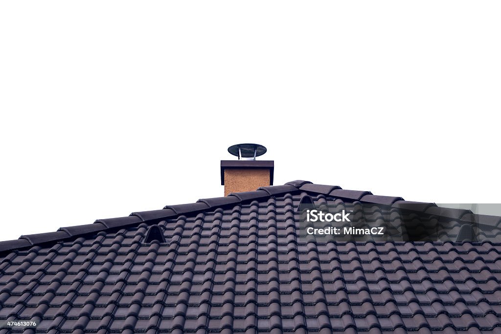 Orange chimney on tiled roof with isolated sky 2015 Stock Photo