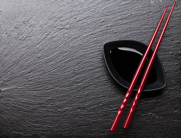 istock Japanese sushi chopsticks over soy sauce bowl 474613492
