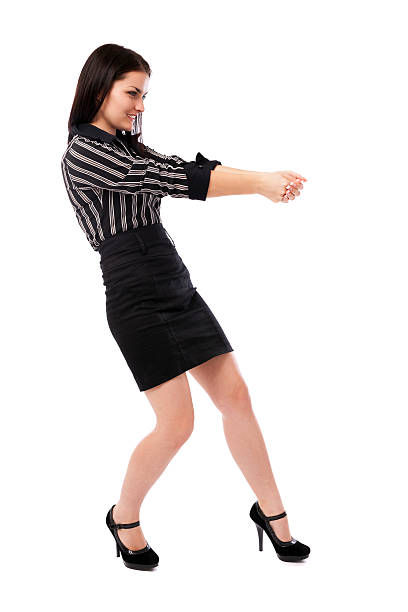 istock Young businesswoman pulling an imaginary rope 474617467