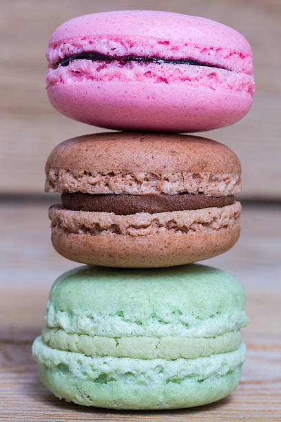 istock Colorful macarons on a rustic wooden macro 474617946