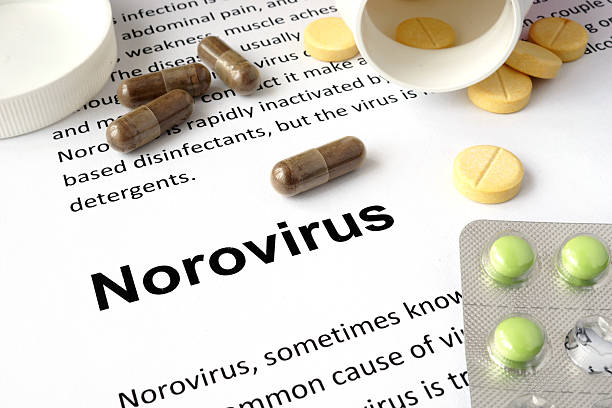 istock Paper with norovirus and pills. 474618582