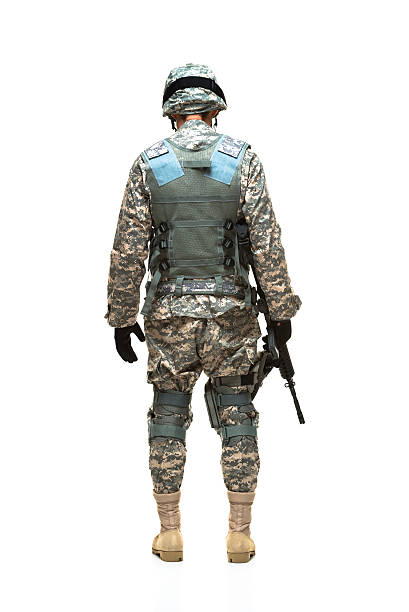 istock Rear view of army soldier with rifle 474618975