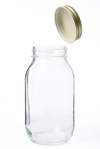 Opened empty new jar isolated on white background with clipping path.