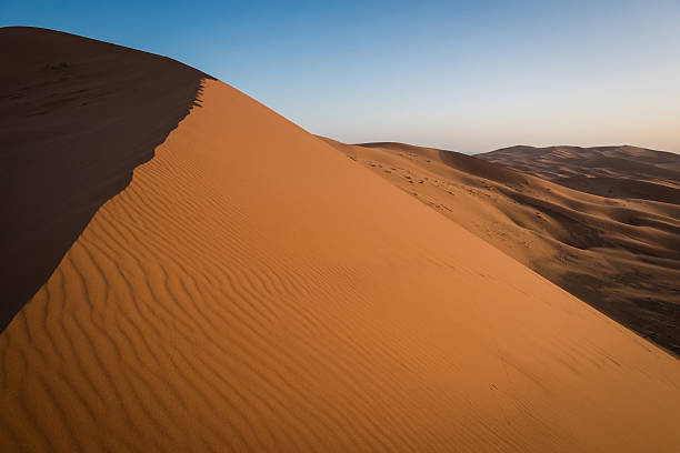 istock Erg Chebbi dunes in Moroccan Sahara Desert at sunrise 474623920