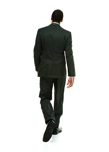istock Rear view of businessman walking 474623980