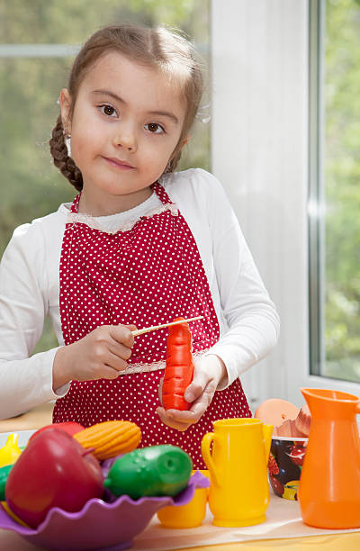 istock Little girl play cooking 474624476