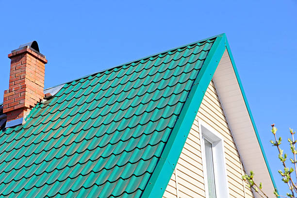 istock Mint color tiled roof and brick chimney. 474626480