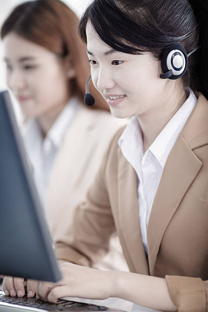 istock Asian women call center with phone headset 474630314