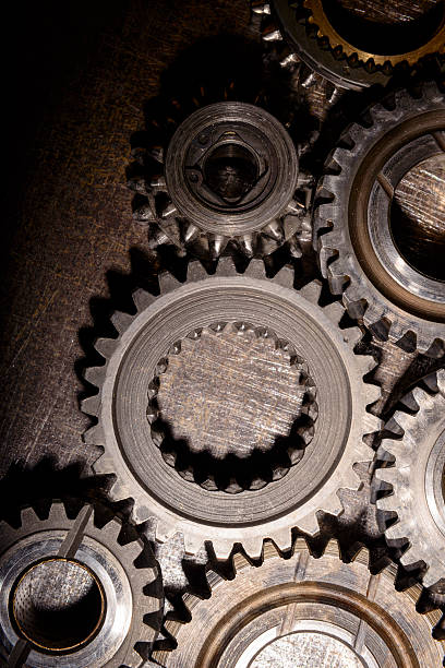 istock gears on metal background 474631888