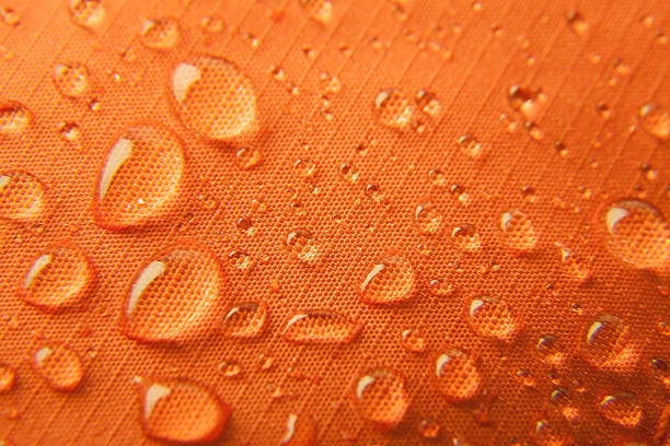 Orange waterproof textile background Orange waterproof textile background  horizontal water repellent stock pictures, royalty-free photos & images