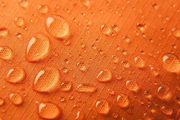 Orange waterproof textile background  horizontal