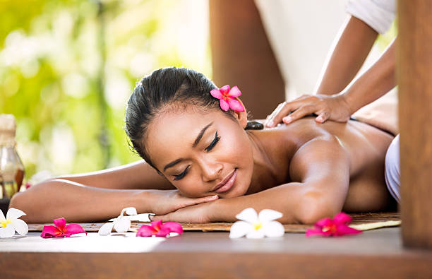 istock Woman having relaxing massage in spa salon 474642170