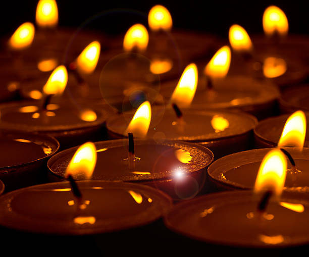 istock Group of burning round candles on black background 474645266