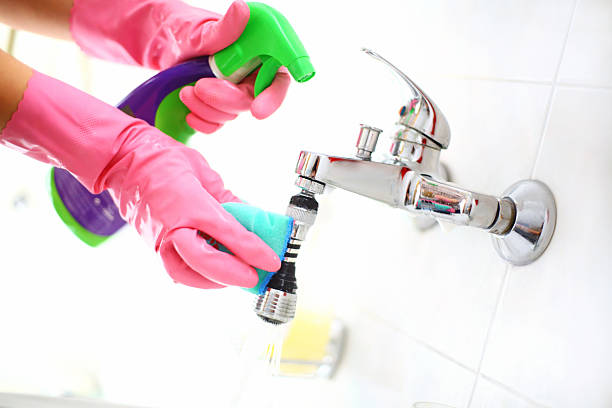 istock Cleaning bathroom faucet. 474647834