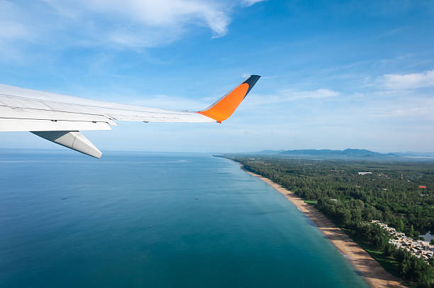 istock Airplane taking off from the island 474648666