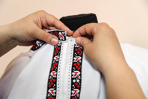 istock Female tailor captures shirt collar 474648986